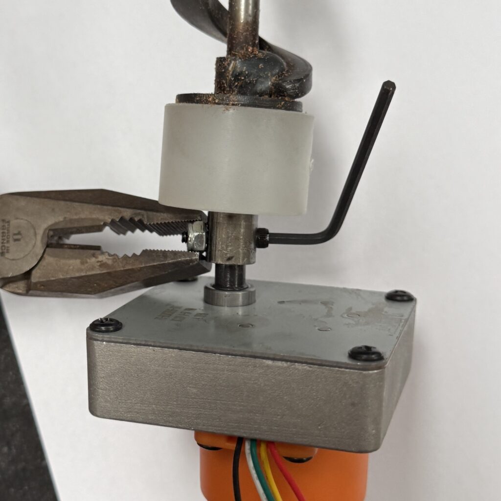 Remove auger shaft bolt